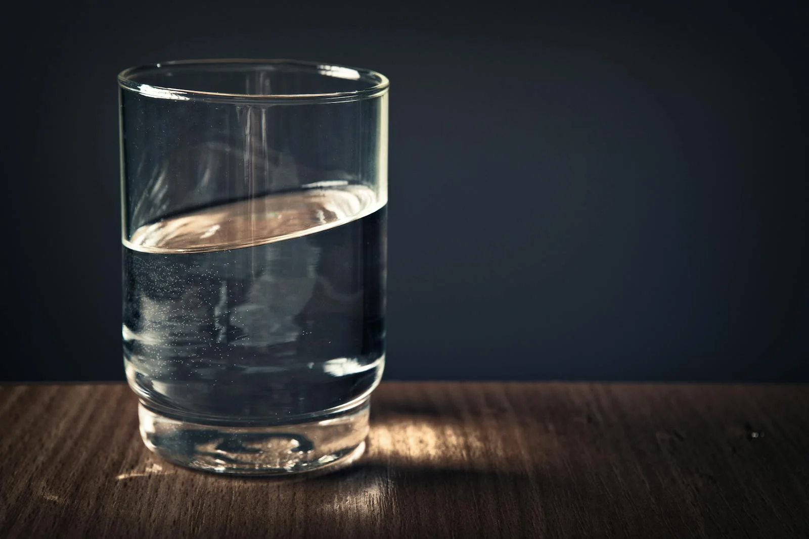 Still glass of purified water — clarity and mineral content preserved